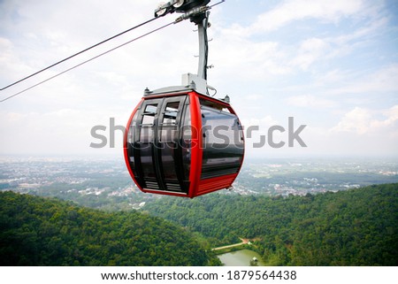 Cable car trip to viewpoints in the mountains. During the trip by cable car Tourists enjoy beautiful views and experience exciting.