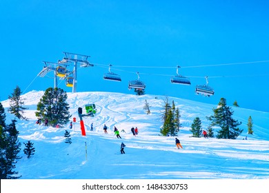 Cable cars and chair lifts of Penken park ski resort in Tyrol in Mayrhofen in Zillertal valley, Austria, winter Alps. Alpine mountains with white snow, blue sky. Downhill fun at Austrian snowy slopes - Powered by Shutterstock