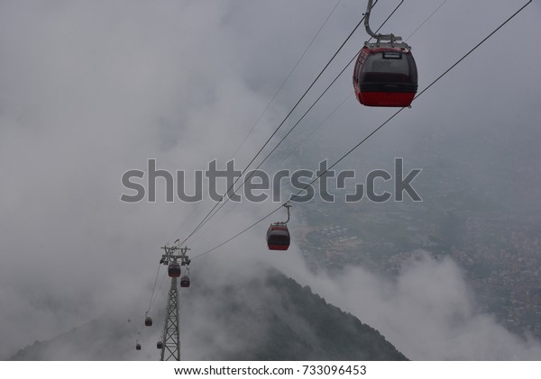 Cable cars at  the top of the hills nearby\
Kathmandu valley, Nepal.