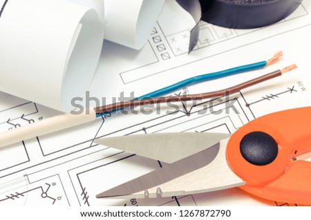 Cable cutter and electric cable with construction drawing of house, accessories for engineer jobs