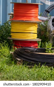 Cable Drums With Black, Red, Yellow And Orange Cables