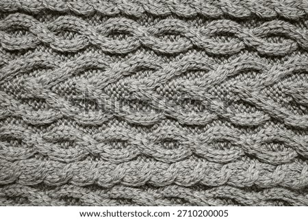 cable knit sweater pattern. Cozy nordic background. Ornate wool texture color of 2026 year cloud white