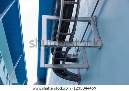Cable ladder install on steel support that fix at concrete wall