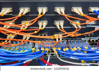 cable network , fiber optic cable connect to switch port in server room , Concept network management - Powered by Shutterstock