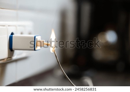 The cable plugged into the socket caught fire. Danger of using a broken cable