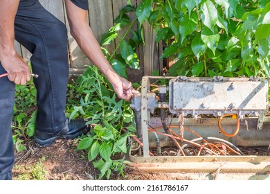 Cable Repair Man Servicing A Coaxial Internet And Video Cable Junction On A Residential Home Façade.