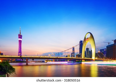 cable stayed bridge over a river at night