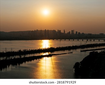 Cable stayed bridge over St Lawrence River at golden sunrise near Montreal and Brossard, Canada. g.