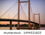 Cable suspension bridge over Columbia river in Tri-Cities Washington State at dusk                             