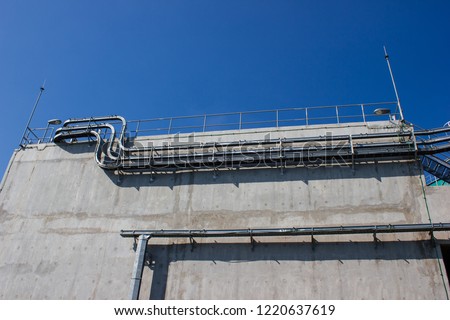 Cable tray and cable ladder installed at concrete wall