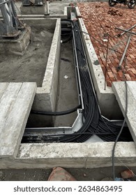 A cable trench is a protective underground or surface channel for electrical cables, ensuring safe routing and insulation. It prevents damage, enhances organization, and supports reliable protection