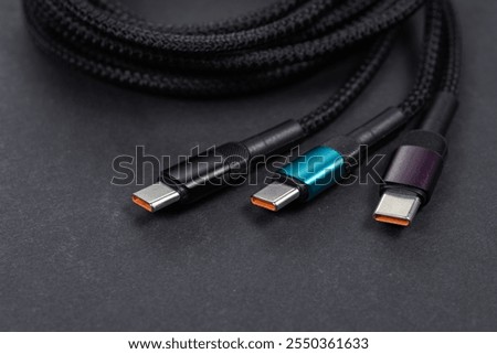 Cable with USB Type-C connector, on dark background.