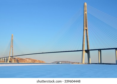 Cable-stayed bridge to island Russian in winter evening. Vladivostok, Primorsky Krai, Russia