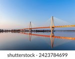 Cable-stayed bridge in the light of the morning sun and against the background of a clear blue sky. Murom. Russia.