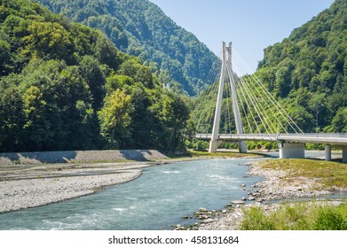 Cable-stayed bridge on the river in the mountains