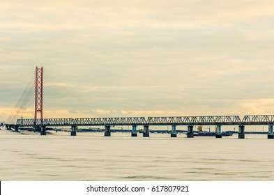Cable-stayed bridge in winter evening. The biggest bridge in the world with one pylon tower across Ob river in Siberia. Toned.
