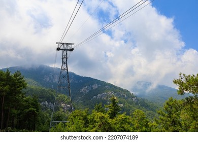 Cableway in the mountains, selective focus. Background with copy space for text