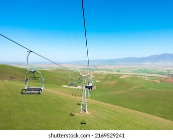 Cableway in the summer in the mountains. Kyrgyzstan, recreation center Orlovka. tourism and travel.