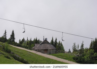 Cableway and traditional Shepard cottage on top of a hill , Velika Planina, Slovenia
