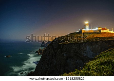 Similar – Leuchtturm an felsiger Küste am Meer