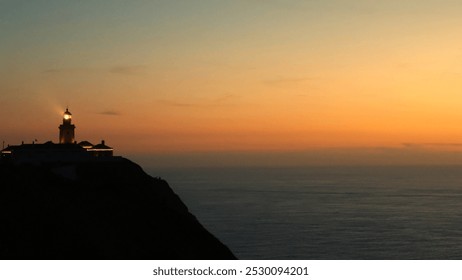 Cabo da Roca, sunset, Atlantic Ocean, lighthouse, coastal, Portugal, cliffs, ocean view, dramatic sky, seascape, golden hour, nature, picturesque, horizon, waves, rugged coastline, dusk, landmark, tra - Powered by Shutterstock