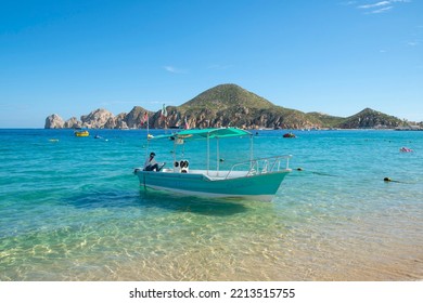 Cabo San Lucas, BCS, Mexico - October 6, 2022: A Tour Operator Waits In His Boat In The Beautiful Calm Bay Of Cabo San Lucas, Mexico.