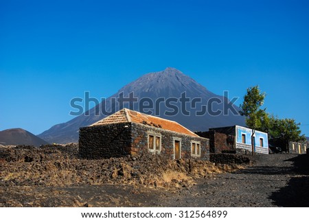 Cabo Verde, Pico do Fogo, Caldera.
Volcano Pico do Fogo, 2829 m, the highest mountain of Cabo Verde standing isolated in the burned Lava fields.
Hauses of igneous rocks in the Cha das Caldeiras.