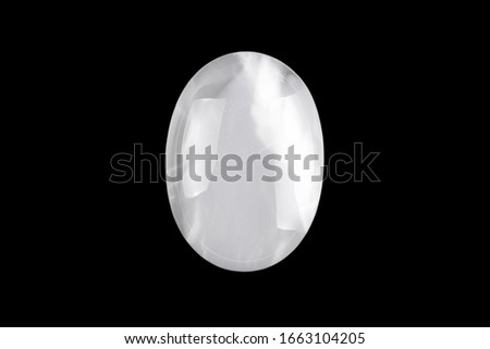 Cabochons made of natural stone on a black background