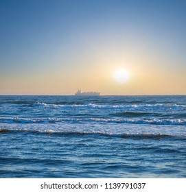 Cabotage Cargo Ship In A Sea At The Sunrise