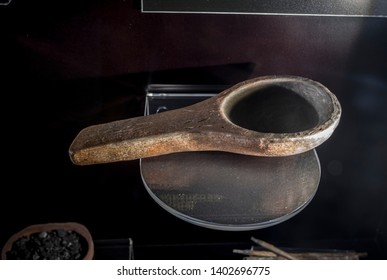 Cabra, Spain - May 19th, 2019: Lascaux red sandstone lamp, the first lamp to be recognised as such. Cabra Archaeoligical Museum