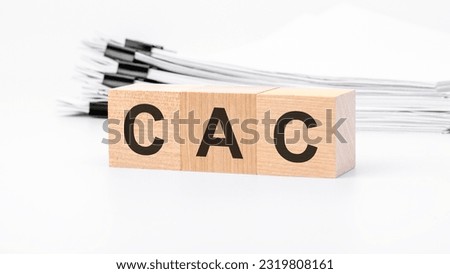 CAC wooden cubes word on white background. CAC - Customer Acquisition Cost concepts