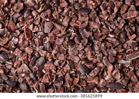 Cacao nibs background, close up