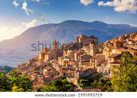 Caccamo, Sicily. Medieval Italian city with the Norman Castle in Sicily mountains, Italy. View of Caccamo town on the hill with mountains in the background, Sicily, Italy.