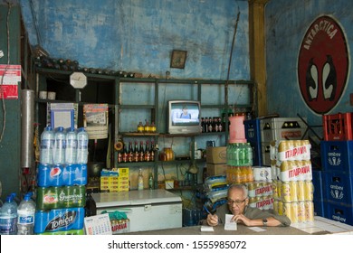 Cachoeira, Bahia, Brazil - July 13, 2016: Vendor Doing The Math At The Counter Of Antique Liquor Store In Cachoeira, At Reconcavo Baiano, Salvador Metropolitan Region