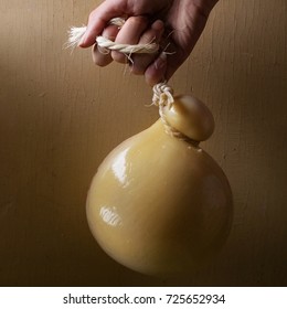 Caciocavalio cheese over rustic background. Square image