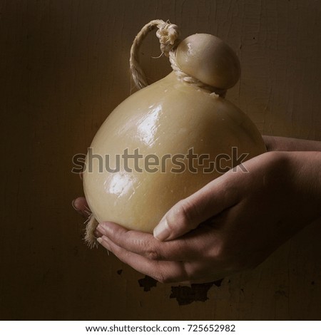 Caciocavalio cheese over rustic background. Square image