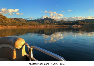 The Cactus Covered Hills Reflect On The Glass-like Surface Of Bartlett Lake While On A Pontoon Ride