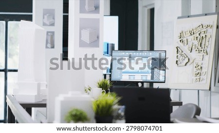 CAD architecture software on computer at empty office desk, urbanistic project plans and blueprints placed on table, modern engineering unicorn business workstations with industrial tools.