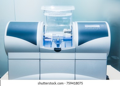 CAD CAM Dental Computer-aided Machine In A Highly Modern Dental Laboratory For Prosthesis And Crowns Milling. Dentistry, Prostodontics, Prosthetics And Medical Computer Technology Concept.