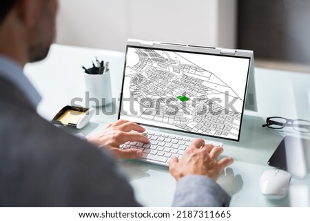 Cadastre Map And City Building Survey On Laptop