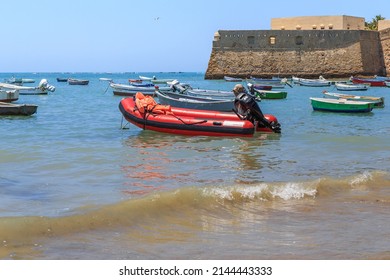 CADIZ, SPAIN - MAY 22, 2017: These are small boats at anchorage near the walls of Santa Catalina Castle.