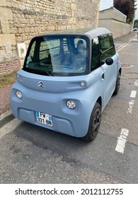 CAEN, FRANCE - JULY 2021: Citroen Ami Electric Car, Tiny Cube On The Wheels Of The Vehicle