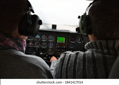 CAEN, FRANCE - JUNE Circa, 2015. View From Over Snow Covered Peaks While Flying In Small Plane CESNA. Lesson For New Pilot, With Airplane Teacher.