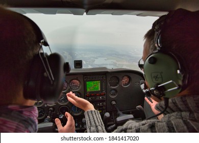 CAEN, FRANCE - JUNE Circa, 2015. View From Over Snow Covered Peaks While Flying In Small Plane CESNA. Lesson For New Pilot, With Airplane Teacher.