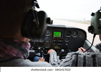 CAEN, FRANCE - JUNE Circa, 2015. View From Over Snow Covered Peaks While Flying In Small Plane CESNA. Lesson For New Pilot, With Airplane Teacher.