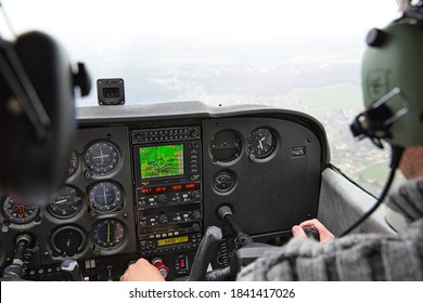 CAEN, FRANCE - JUNE Circa, 2015. View From Over Snow Covered Peaks While Flying In Small Plane CESNA. Lesson For New Pilot, With Airplane Teacher.