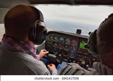 CAEN, FRANCE - JUNE Circa, 2015. View From Over Snow Covered Peaks While Flying In Small Plane CESNA. Lesson For New Pilot, With Airplane Teacher.