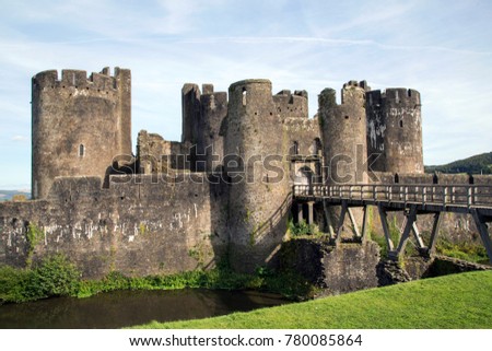 Caerphilly Castle was constructed by Gilbert de Clare in the 13th century as part of his campaign to conquer Glamorgan, it is the second largest castle in Britain. Rear entrance with bridge and moat. 