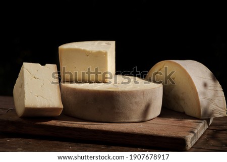 caerphilly Cheese still life with a black background