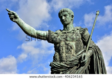 Caesar Augustus, the first emperor of Ancient Rome. Bronze monumental statue in the center of Rome, with beautiful sky